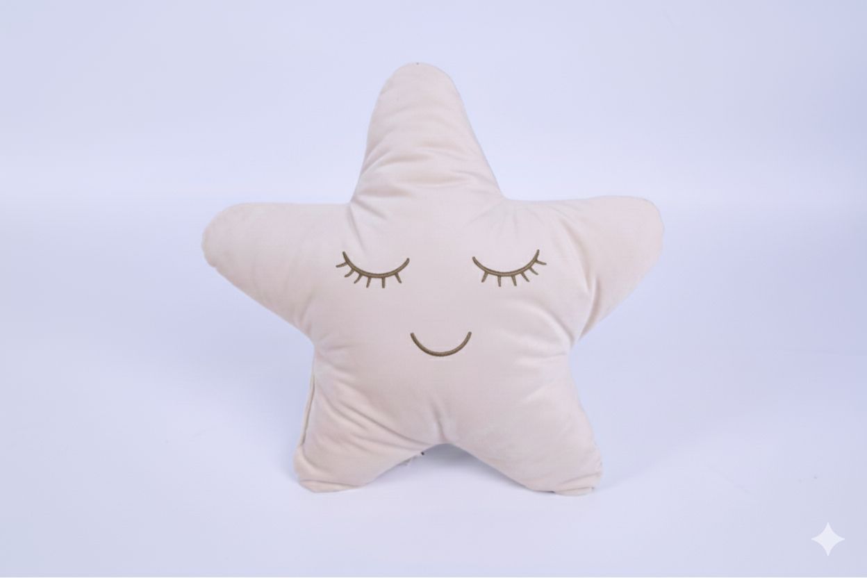 Star-shaped pillow with a smiley face on a light blue background
