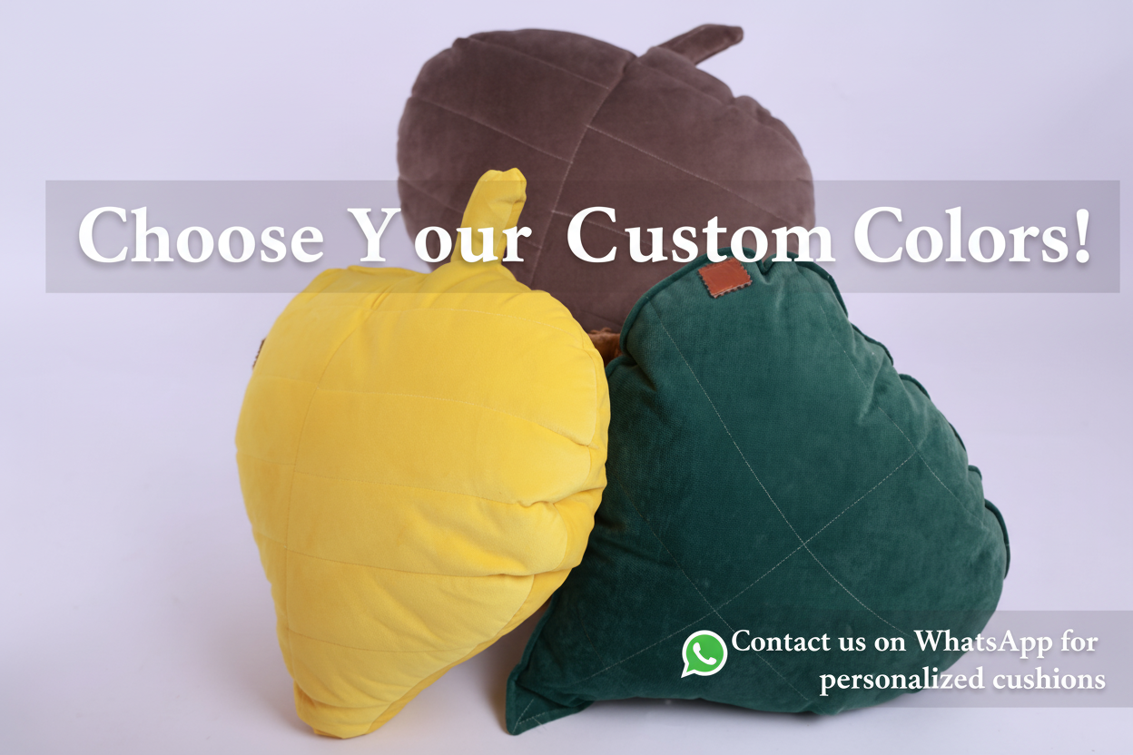 Three cushion-shaped objects resembling leaves on a white background